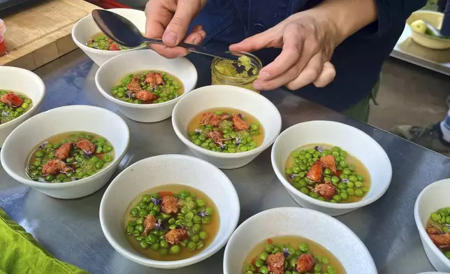 A crayfish dish is prepared in Martin Roetzel's 'The Monk Garden' in Berlin, Germany, Sunday, Aug. 17, 2025. (AP Photo/Fanny Brodersen)