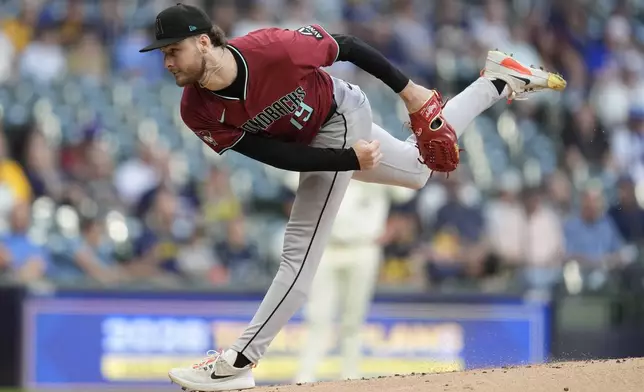 Arizona Diamondbacks' Ryne Nelson pitches during the first inning of a baseball game against the Milwaukee Brewers, Wednesday, Aug. 27, 2025, in Milwaukee. (AP Photo/Aaron Gash)
