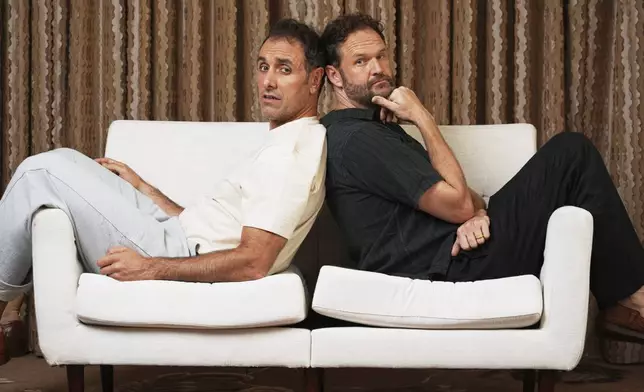 Michael Angelo Covino, left, director/co-screenwriter of the comedy film "Splitsville," and co-screenwriter/cast member Kyle Marvin pose for a portrait on Thursday, Aug. 14, 2025, in Los Angeles. (AP Photo/Chris Pizzello)