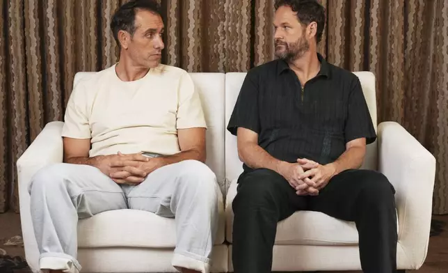Michael Angelo Covino, left, director/co-screenwriter of the comedy film "Splitsville," poses with co-screenwriter/cast member Kyle Marvin on Thursday, Aug. 14, 2025, in Los Angeles. (AP Photo/Chris Pizzello)