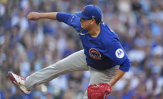 Chicago Cubs starting pitcher Javier Assad works against the Colorado Rockies in the first inning of a baseball game Saturday, Aug. 30, 2025, in Denver. (AP Photo/David Zalubowski)