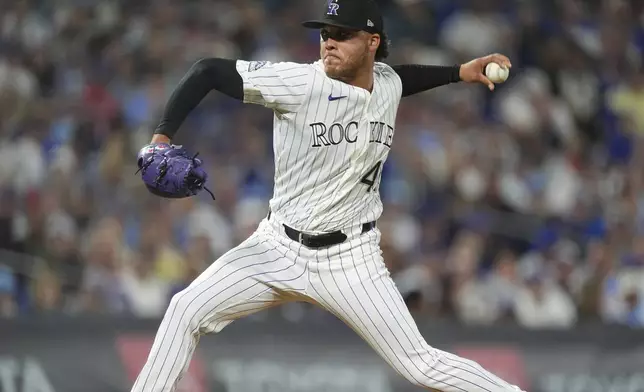 Colorado Rockies relief pitcher Luis Peralta works against the Chicago Cubs in the seventh inning of a baseball game Saturday, Aug. 30, 2025, in Denver. (AP Photo/David Zalubowski)