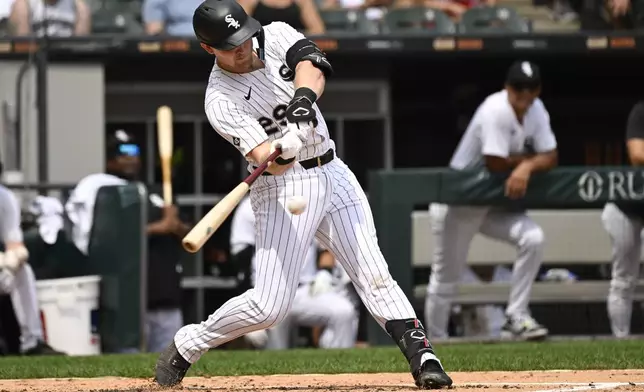 Chicago White Sox's Curtis Mead hits an RBI single during the third inning of a baseball game against the Cleveland Guardians, Sunday, Aug. 10, 2025, in Chicago. (AP Photo/Matt Marton)