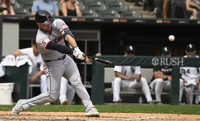 Cleveland Guardians' David Fry hits an RBI double during the sixth inning of a baseball game against the Chicago White Sox, Sunday, Aug. 10, 2025, in Chicago. (AP Photo/Matt Marton)
