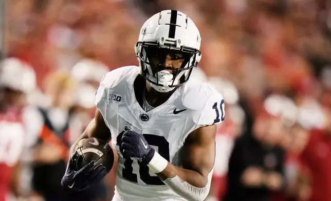 FILE - Penn State's Nicholas Singleton (10) carries the ball during the first half of an NCAA college football game against Wisconsin, Saturday, Oct. 26, 2024, in Madison, Wis. (AP Photo/Morry Gash, File)