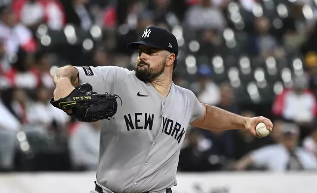 New York Yankees pitcher Carlos Rodón delivers during the first inning of a baseball game against the Chicago White Sox, Friday, Aug. 29, 2025, in Chicago. (AP Photo/Matt Marton)