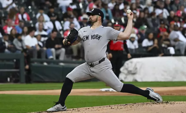 New York Yankees pitcher Carlos Rodón delivers during the first inning of a baseball game against the Chicago White Sox, Friday, Aug. 29, 2025, in Chicago. (AP Photo/Matt Marton)