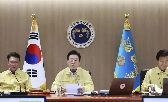 South Korean President Lee Jae Myung, center, speaks during a cabinet meeting at the presidential office in Seoul, South Korea, Monday, Aug. 18, 2025. (Hong Hae-in/Yonhap via AP)