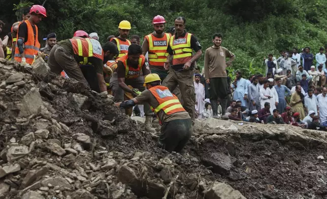 Rescue workers search victims through the rubble of damaged homes following Monday's flash flooding due to heavy rains, in Dalori village in Swabi, a district of Pakistan's Khyber Pakhtunkhwa province, Tuesday, Aug. 19, 2025. (AP Photo/Muhammad Zubair)