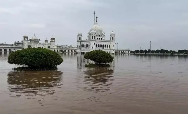 The Gurdwara Darbar Sahib, a shrine of Guru Nanak Dev, is submerged after torrential rains, in Kartarpur, in Narowal district, Pakistan, Wednesday, Aug. 27, 2025. (AP Photo/Jahan Zab)