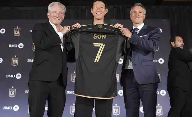 Son Heung-min, of South Korea, is introduced as a new member of Los Angeles FC during a press conference for the MLS soccer team Wednesday, Aug. 6, 2025, in Los Angeles. (AP Photo/Damian Dovarganes)