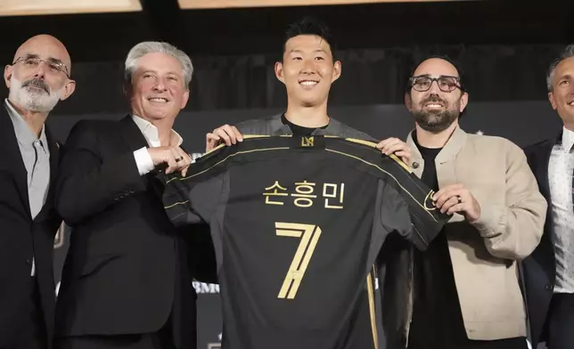 Son Heung-min, of South Korea, is introduced as a new member of Los Angeles FC during a press conference for the MLS soccer team Wednesday, Aug. 6, 2025, in Los Angeles. (AP Photo/Damian Dovarganes)