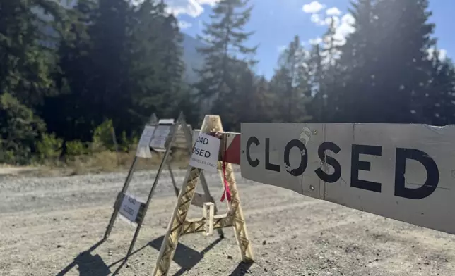 This photo provided by FBI Seattle shows a closed road to Rock Island Campground where multiple law enforcement agencies are participating in the search for Travis Decker, who was charged with murder and kidnapping, near Leavenworth, Wa. on Monday, August. 25, 2025. (FBI via AP)