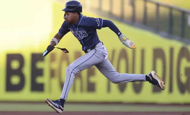 Tampa Bay Rays' Chandler Simpson sprints to second base after a fielding error by Athletics first baseman Tyler Soderstrom during the first inning of a baseball game, Wednesday, Aug. 13, 2025, in West Sacramento, Calif. (AP Photo/Scott Marshall)