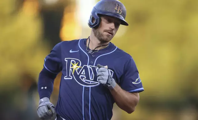 Tampa Bay Rays' Brandon Lowe jogs around the bases after hitting a two-run home run during the second inning of a baseball game against the Athletics, Wednesday, Aug. 13, 2025, in West Sacramento, Calif. (AP Photo/Scott Marshall)