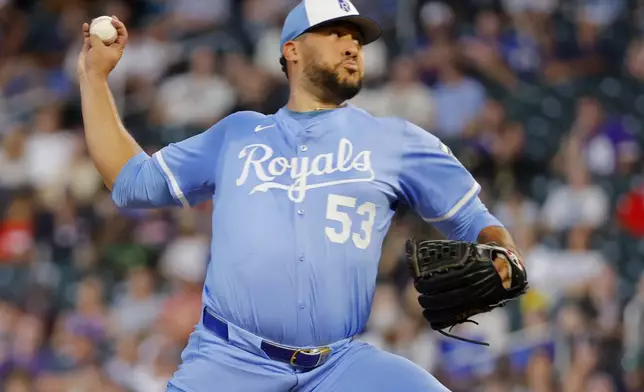 Kansas City Royals relief pitcher Carlos Estevez throws to the Minnesota Twins in the ninth inning of a baseball game Saturday, Aug. 9, 2025, in Minneapolis. (AP Photo/Bruce Kluckhohn)