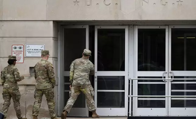 National Guard troops arrive at the District of Columbia National Guard Headquarters, Tuesday, Aug. 12, 2025, in Washington. (AP Photo/Julia Demaree Nikhinson)