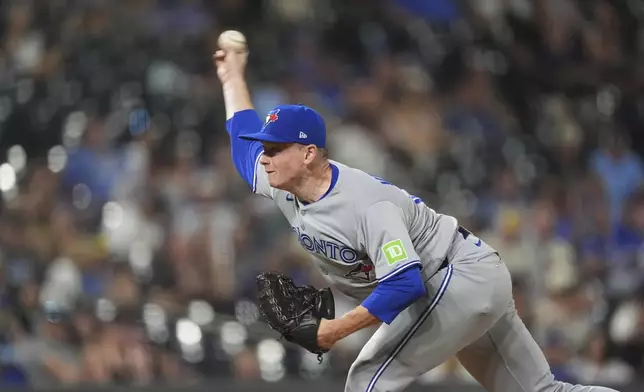Toronto Blue Jays reliever Louis Varland pitches against the Colorado Rockies in the eighth inning of a baseball game Tuesday, Aug. 5, 2025, in Denver. (AP Photo/David Zalubowski)