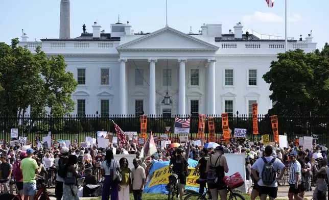 Activists protest President Donald Trump's federal takeover of policing of the District of Columbia near the White House, Saturday, Aug. 16, 2025, in Washington. (AP Photo/Alex Brandon)