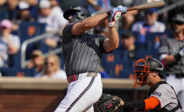 New York Mets' Pete Alonso hits a two-run home run during the first inning of a baseball game against the San Francisco Giants, Saturday, Aug. 2, 2025, in New York. (AP Photo/Yuki Iwamura)