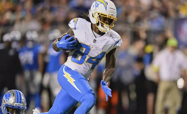 Los Angeles Chargers wide receiver KeAndre Lambert-Smith catches a pass and runs into the end zone for a touchdown in the first half of the Pro Football Hall of Fame NFL preseason game Thursday, July 31, 2025, in Canton, Ohio. (AP Photo/David Dermer)
