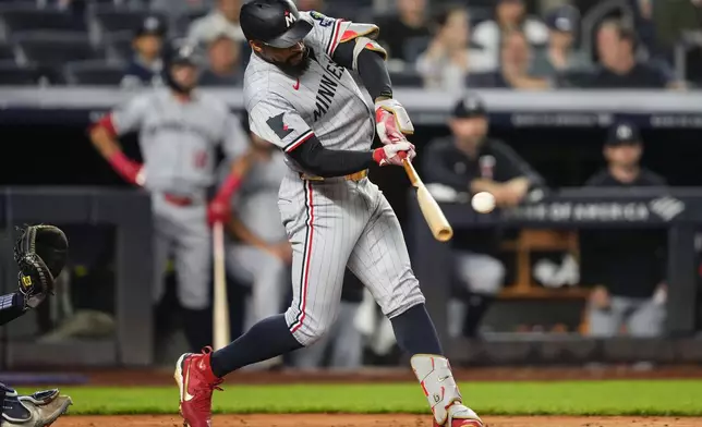 Minnesota Twins' Byron Buxton hits a double during the fourth inning of a baseball game against the New York Yankees, Wednesday, Aug. 13, 2025, in New York. (AP Photo/Yuki Iwamura)