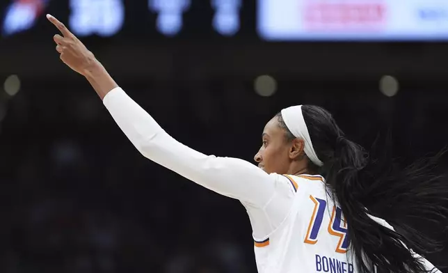 Phoenix Mercury forward DeWanna Bonner reacts after making a basket against the Seattle Storm during the first half of a WNBA basketball game Sunday, Aug. 17, 2025, in Seattle. (AP Photo/Lindsey Wasson)
