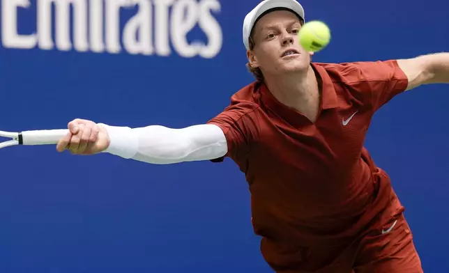 Jannik Sinner, of Italy, returns a shot to Alexei Popyrin, of Australia, during the second round of the U.S. Open tennis championships, Thursday, Aug. 28, 2025, in New York. (AP Photo/Seth Wenig)