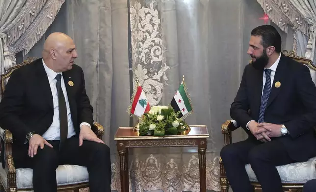 FILE - In this photo released by the Lebanese Presidency press office, Lebanese president Joseph Aoun, left, meets with Syria's interim President Ahmad al-Sharaa during the emergency Arab summit at Egypt's New Administrative Capital, just outside Cairo, Tuesday, March 4, 2025. (Lebanese Presidency press office via AP, File)
