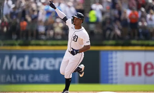Detroit Tigers' Wenceel Perez gestures while running the bases after hitting a solo home run during the fifth inning of a baseball game against the Kansas City Royals, Sunday, Aug. 24, 2025, in Detroit. (AP Photo/Ryan Sun)