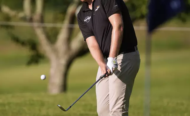 Harry Hall, of England, chips on second hole during the first round of the St. Jude Championship golf tournament Thursday, Aug. 7, 2025, in Memphis, Tenn. (AP Photo/George Walker IV)