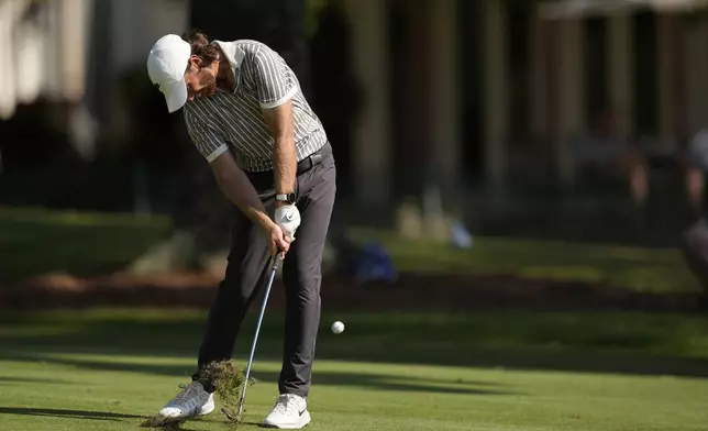 Tommy Fleetwood, of England, hits on the 17th hole during the first round of the St. Jude Championship golf tournament Thursday, Aug. 7, 2025, in Memphis, Tenn. (AP Photo/George Walker IV)