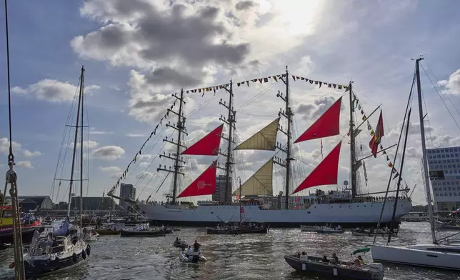 Hundreds of tall ships sailed into the Dutch capital's harbor for the 10th edition of SAIL, in Amsterdam, Netherlands, Wednesday, Aug. 20, 2025. (AP Photo/Peter Dejong)