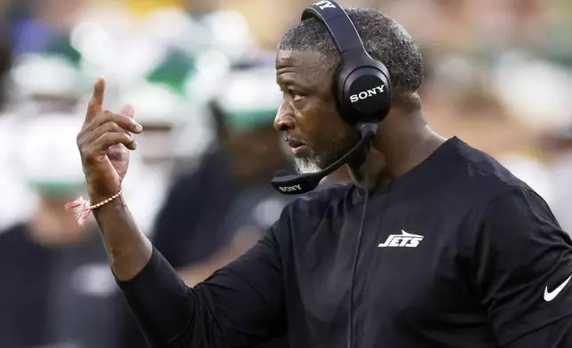 New York Jets head coach Aaron Glenn reacts during the first half of a preseason NFL football game against the Green Bay Packers Saturday, Aug. 9, 2025, in Green Bay, Wis. (AP Photo/Matt Ludtke)