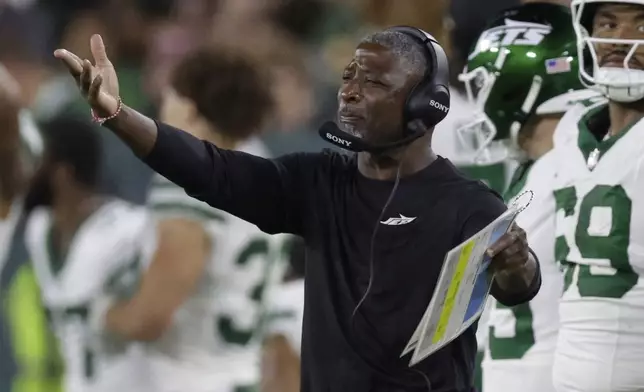 New York Jets head coach Aaron Glenn reacts to a call during the second half of a preseason NFL football game against the Green Bay Packers Saturday, Aug. 9, 2025, in Green Bay, Wis. (AP Photo/Matt Ludtke)