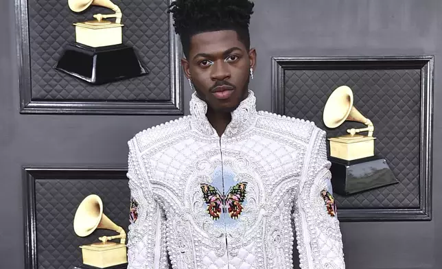 FILE - Lil Nas X arrives at the 64th Annual Grammy Awards at the MGM Grand Garden Arena on Sunday, April 3, 2022, in Las Vegas. (Photo by Jordan Strauss/Invision/AP, File)