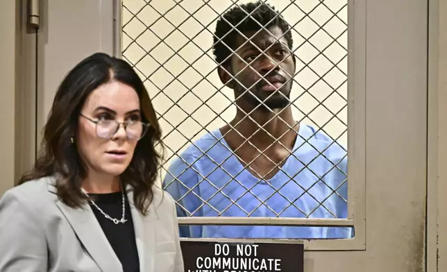 Lil Nas X, whose legal name is Montero Lamar Hill, is arraigned in court, next to his attorney Christy O'Connor, on four felony counts, including three counts of battery with injury on a police officer, Monday, Aug. 25, 2025, in Los Angeles. (Frederic J Brown/Pool Photo via AP)