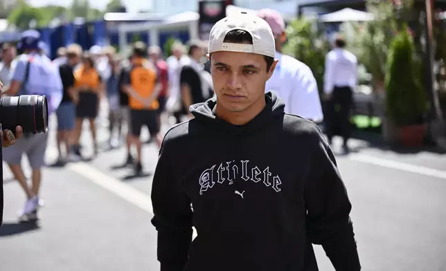 McLaren driver Lando Norris of the United Kingdom walks through the paddock at the Hungaroring racetrack, in Mogyoród, Hungary, Thursday, July 31, 2025, ahead of the Hungarian Formula One Grand Prix. (AP Photo/Denes Erdos)