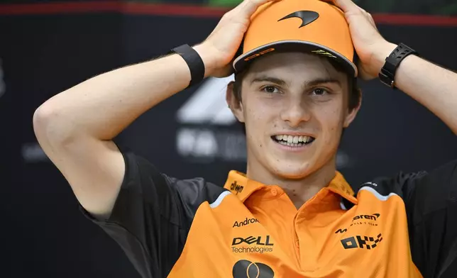 McLaren driver Oscar Piastri of Australia reacts during a press conference at the Hungaroring racetrack, in Mogyoród, Hungary, Thursday, July 31, 2025, ahead of the Hungarian Formula One Grand Prix. (AP Photo/Denes Erdos)