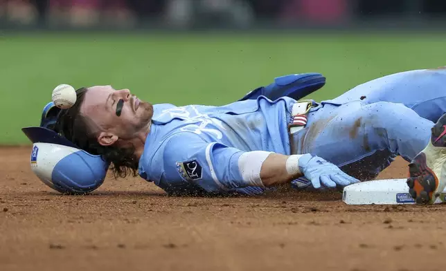 Kansas City Royals shortstop Bobby Witt Jr. steals second base during the first inning of a baseball game against the Detroit Tigers, Saturday, Aug. 30, 2025, in Kansas City, Mo. (AP Photo/David Smith)