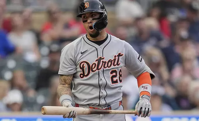 Detroit Tigers' Javier Báez (28) reacts after striking out to end the top of the third inning of a baseball game against the Minnesota Twins Thursday, Aug. 14, 2025, in Minneapolis. (AP Photo/Abbie Parr)