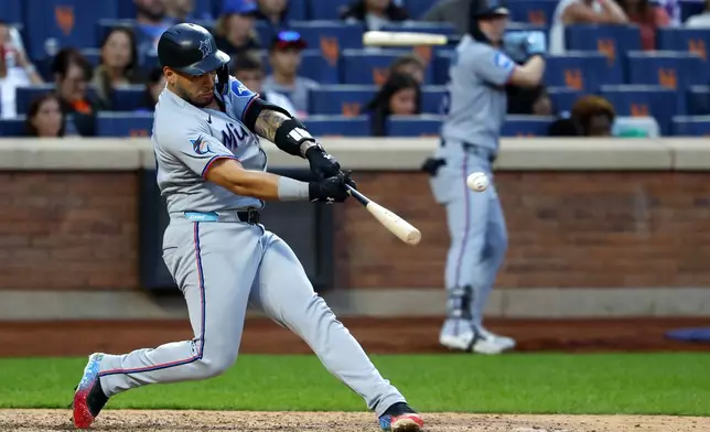 Miami Marlins' Agustín Ramírez hits double during the ninth inning of a baseball game against the New York Mets, Saturday, Aug. 30, 2025, in New York. (AP Photo/Noah K. Murray)