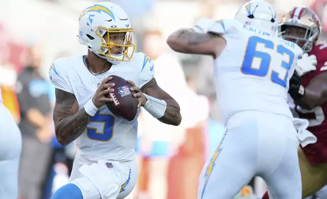 Los Angeles Chargers quarterback Trey Lance (5) drops back to pass against the San Francisco 49ers during the first half of an NFL preseason football game in Santa Clara, Calif., Saturday, Aug. 23, 2025. (AP Photo/Godofredo A. Vásquez)