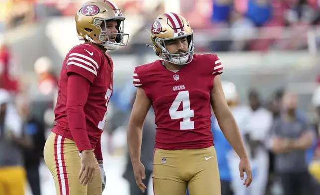 San Francisco 49ers place kicker Jake Moody (4) reacts after missing a point after try with Thomas Morstead during the first half of an NFL preseason football game against the Los Angeles Chargers in Santa Clara, Calif., Saturday, Aug. 23, 2025. (AP Photo/Godofredo A. Vásquez)