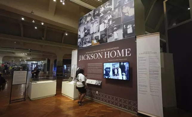 Visitors view a display for The Jackson Home at The Henry Ford in Dearborn, Mich., Monday, July 14, 2025. (AP Photo/Paul Sancya)