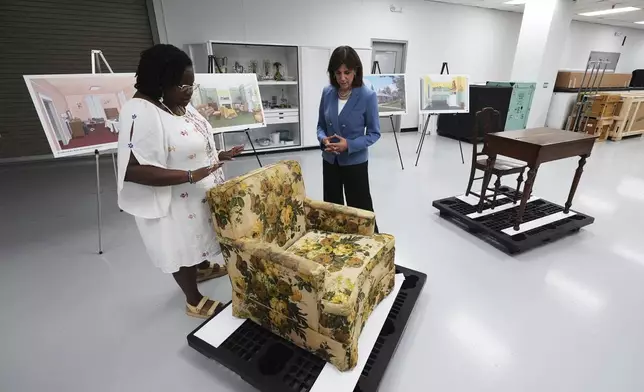 Amber N. Mitchell, Curator of Black History, left, and Patricia Mooradian, President and CEO of The Henry Ford, right, view items from The Jackson Home, where Martin Luther King Jr. and others planned marches to call for Black voting rights in the early 60s in Selma, Ala., at The Henry Ford in Dearborn, Mich., Monday, July 14, 2025. (AP Photo/Paul Sancya)