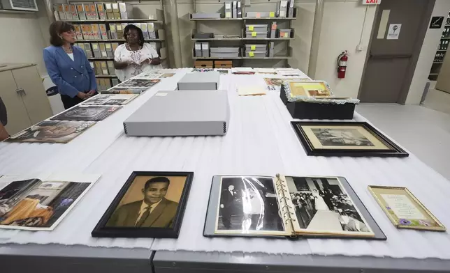 The Henry Ford President and CEO Patricia Mooradian, left, and Amber N. Mitchell, Curator of Black History view items from The Jackson Home at The Henry Ford in Dearborn, Mich., Monday, July 14, 2025. (AP Photo/Paul Sancya)