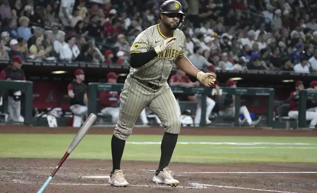 San Diego Padres' Xander Bogaerts reacts after hitting a solo home run against the Arizona Diamondbacks in the seventh inning during a baseball game, Wednesday, Aug 6, 2025, in Phoenix. (AP Photo/Rick Scuteri)