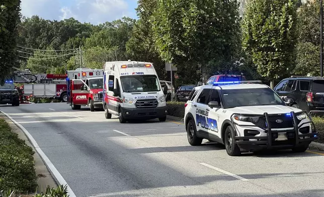 Emergency vehicles line up near Emory University and Centers for Disease Control and Prevention headquarters in Atlanta on Friday, Aug. 8, 2025. (AP Photo/Jeff Amy)