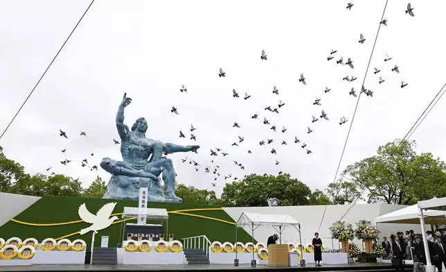 Doves are leased over the Peace Statue during a ceremony to mark the 80th anniversary of the U.S. atomic bombing at the Peace Park in Nagasaki, southern Japan Saturday, Aug. 9, 2025. (Kotaro Ueda/Kyodo News via AP)